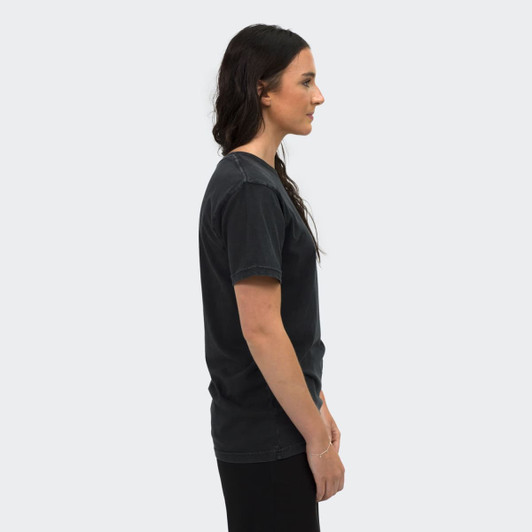 A faded unisex T-shirt in dark grey, displayed on a model from the side. Features a brand logo.