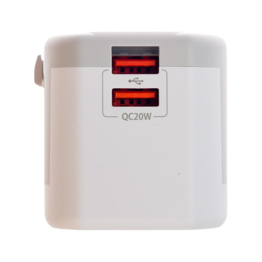 A travel adaptor featuring two USB ports labeled for Quick Charge, designed for international compatibility.
