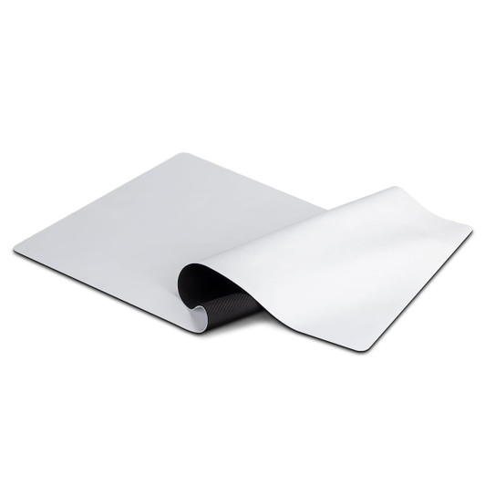 A white desk mat featuring a smooth surface, curved edges, and a textured underside for stability.