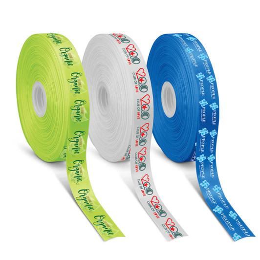 Three rolls of personalised ribbon in green, white, and blue, featuring various printed designs and logos.