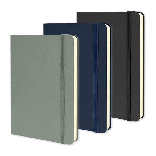 A set of three Moleskine Classic Hard Cover Notebooks in green, navy, and black with elastic closures.