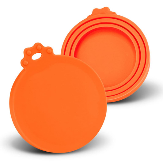 A set of silicone reusable can lids in vibrant orange, featuring a circular design with a handle on top.