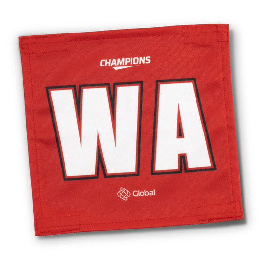 A red netball bib featuring large white letters "WA" and a logo at the bottom.