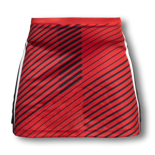 A custom women's netball skirt in red with black diagonal stripes and white side accents. Features a logo.
