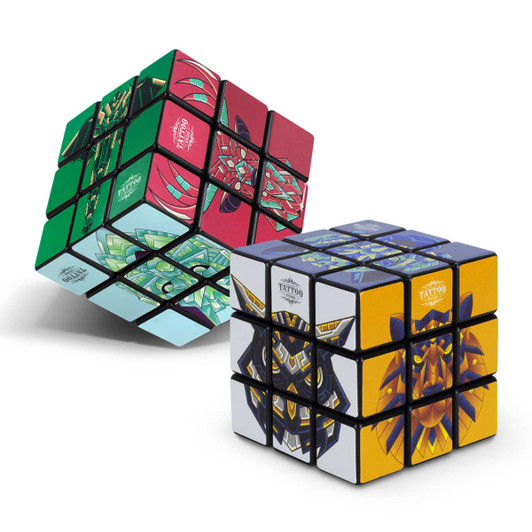Two custom puzzle cubes featuring vivid designs in red, green, and yellow, each with unique patterns and a logo.