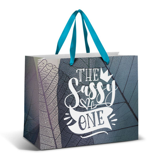 A large paper bag featuring a full colour design with teal ribbon handles and a textured leaf pattern.