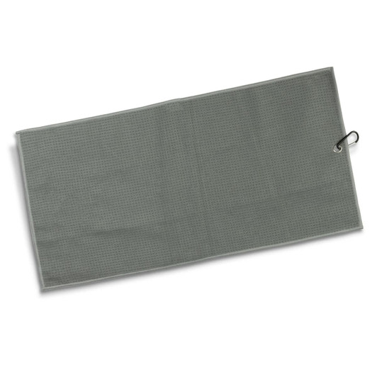 A green waffle texture golf towel with a silver clip. It has a textured pattern throughout its surface.