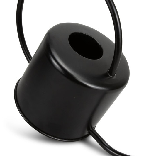 A black metal watering can with a cylindrical body and a curved handle, featuring an opening at the top.