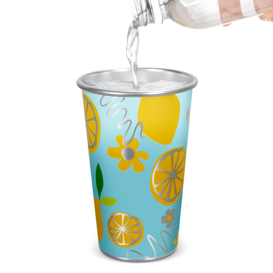 A drink cup featuring a blue design with yellow fruits and flowers, with a silver rim. It has a logo.