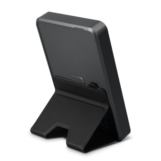A black wireless charging power bank with a foldable stand for stability, featuring a logo on the back.