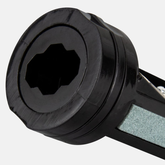 A black carpenter's pencil sharpener with a multi-faceted opening for sharpening pencils. It features a sleek design.