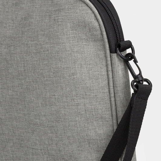 A grey satchel featuring a textured fabric and a black adjustable strap with a clip.