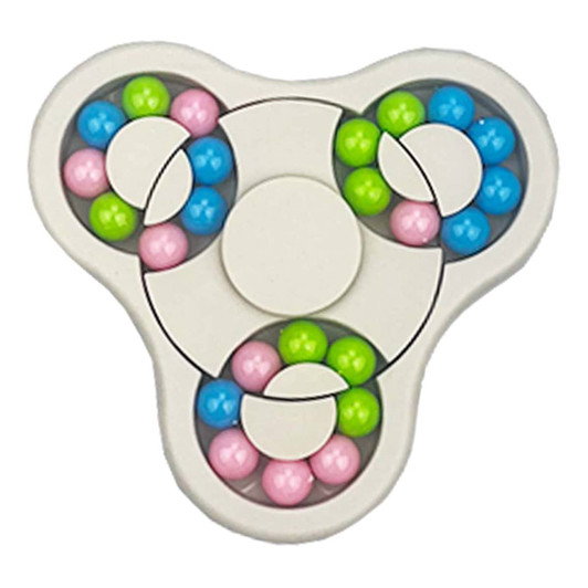 A fidget spinner in white with vibrant blue, pink, green, and purple balls embedded in its design.