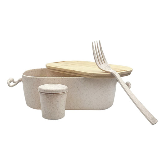 A bamboo lunch box in natural tones with a fork and a small container. The box has a bamboo lid and features a logo.