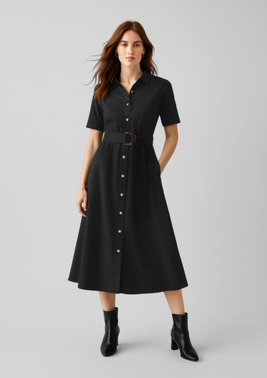A black midi dress with short sleeves, a button-down front, and a belted waist, styled with ankle boots.