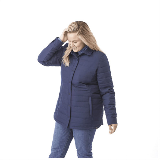 A women's insulated shacket in navy blue with a button-up front and pockets. It has a logo on the sleeve.