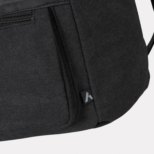 A black canvas cooler bag with a zipped pocket and a subtle logo on the side.