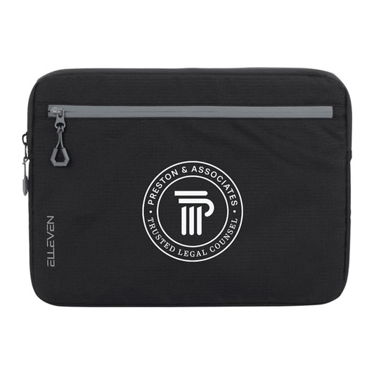 A black laptop sleeve featuring a grey zipper and a circular logo in the centre.