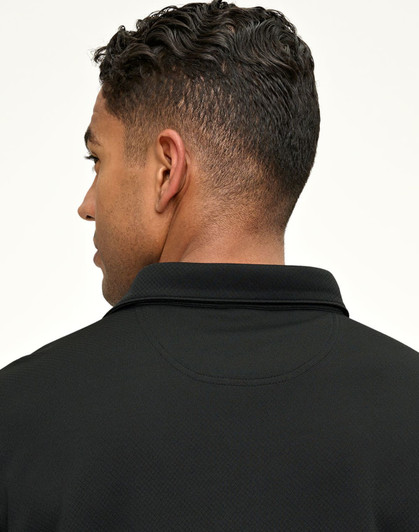 A black men's sustainable jacquard knit short-sleeve polo with a collar, featuring a logo on the back.