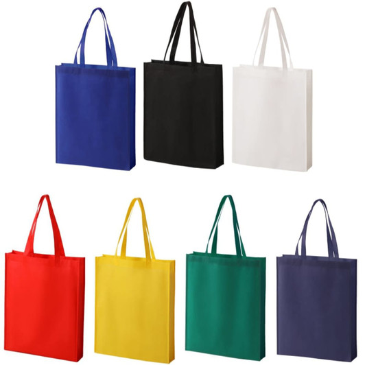 A collection of non-woven tote bags in blue, black, white, red, yellow, green, and dark blue, featuring handles.