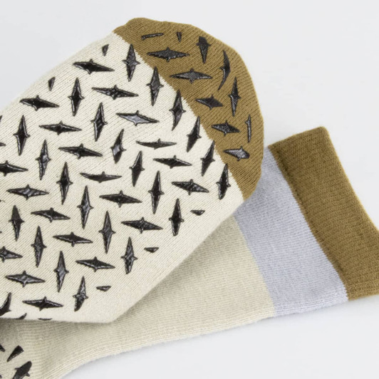 Nero Crew Grip Socks in cream and brown, featuring a textured pattern and contrasting colours on the cuffs.