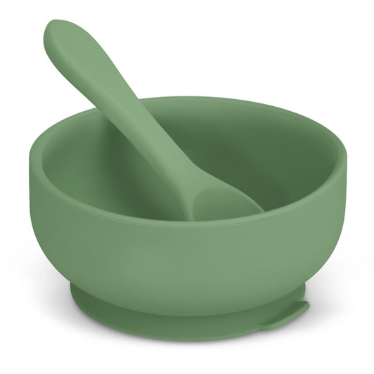 A green suction bowl set for kids featuring a matching spoon. Designed for stability, it includes a logo.