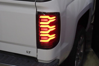 ALPHAREX 620030 14-18 CHEVROLET SILVERADO LUXX-SERIES LED TAIL LIGHTS BLACK W/ACTIV LIGHT/SEQ SIGNAL