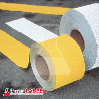 Yellow and White Pavement tape side by side on pavement.