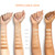 This is an image of product swatches of Impeccable Skin in all 6 shades on 4 different skin tones to assist with shade matching. 