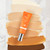 Lifestyle image of the Suntegrity Impeccable Skin laying on swatches of the 7 shades on a marble counter. Lifestyle image of the Suntegrity Impeccable Skin laying on swatches of the 7 shades on a marble counter.