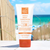 Lifestyle photo of Suntegrity Mineral Body Sunscreen on the beach.