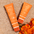 Lifestyle image of Suntegrity scented Mineral Body Sunscreens (3oz & 5oz) on the sand.