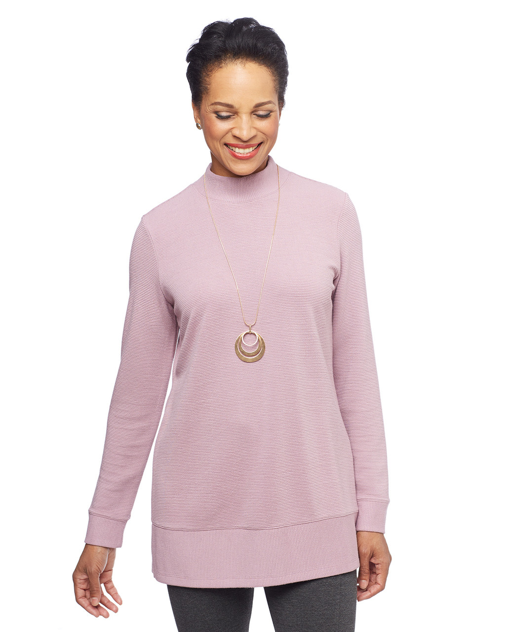 Woman in pink pullover tunic sweater
