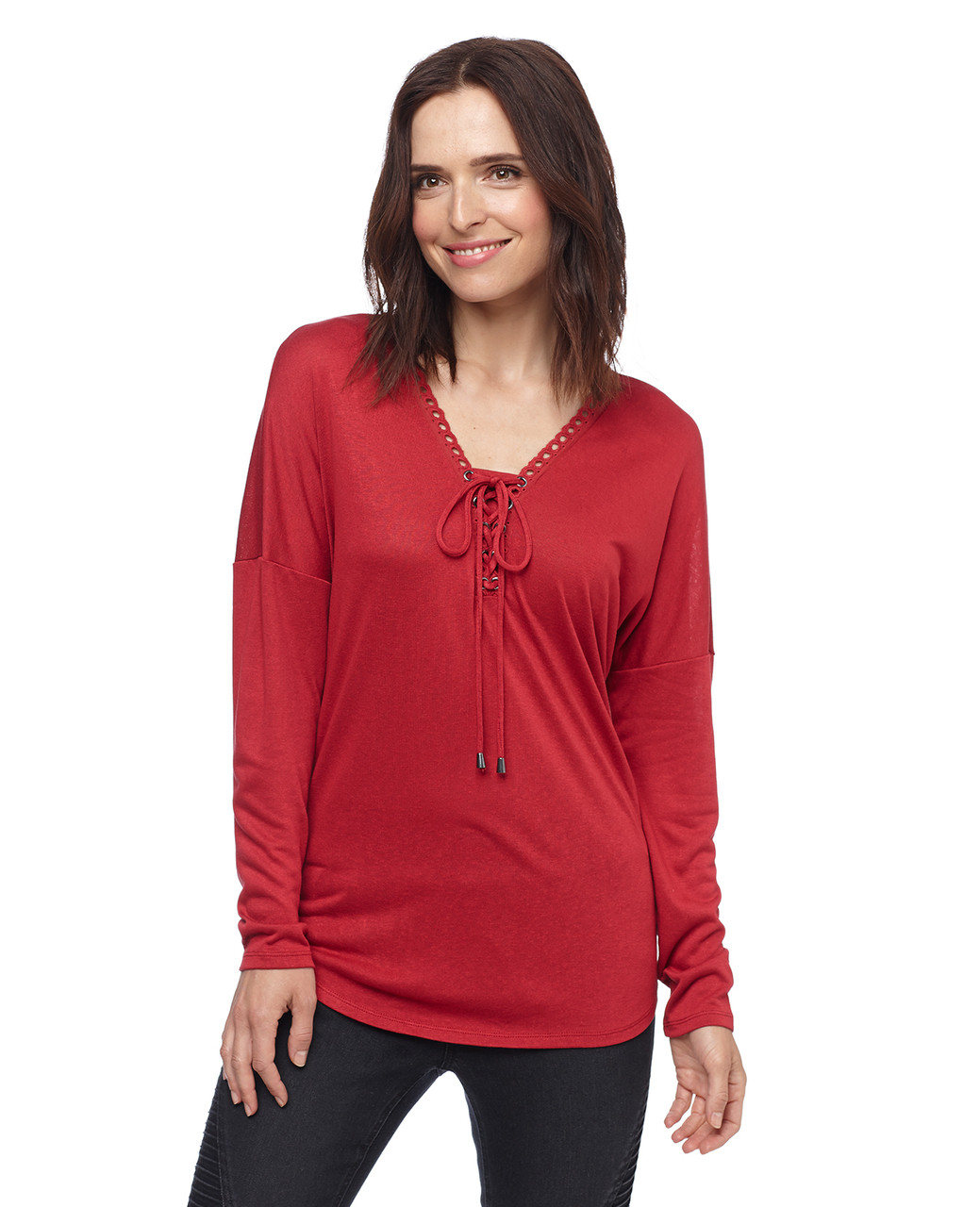 Woman in red lace-up eyelet top