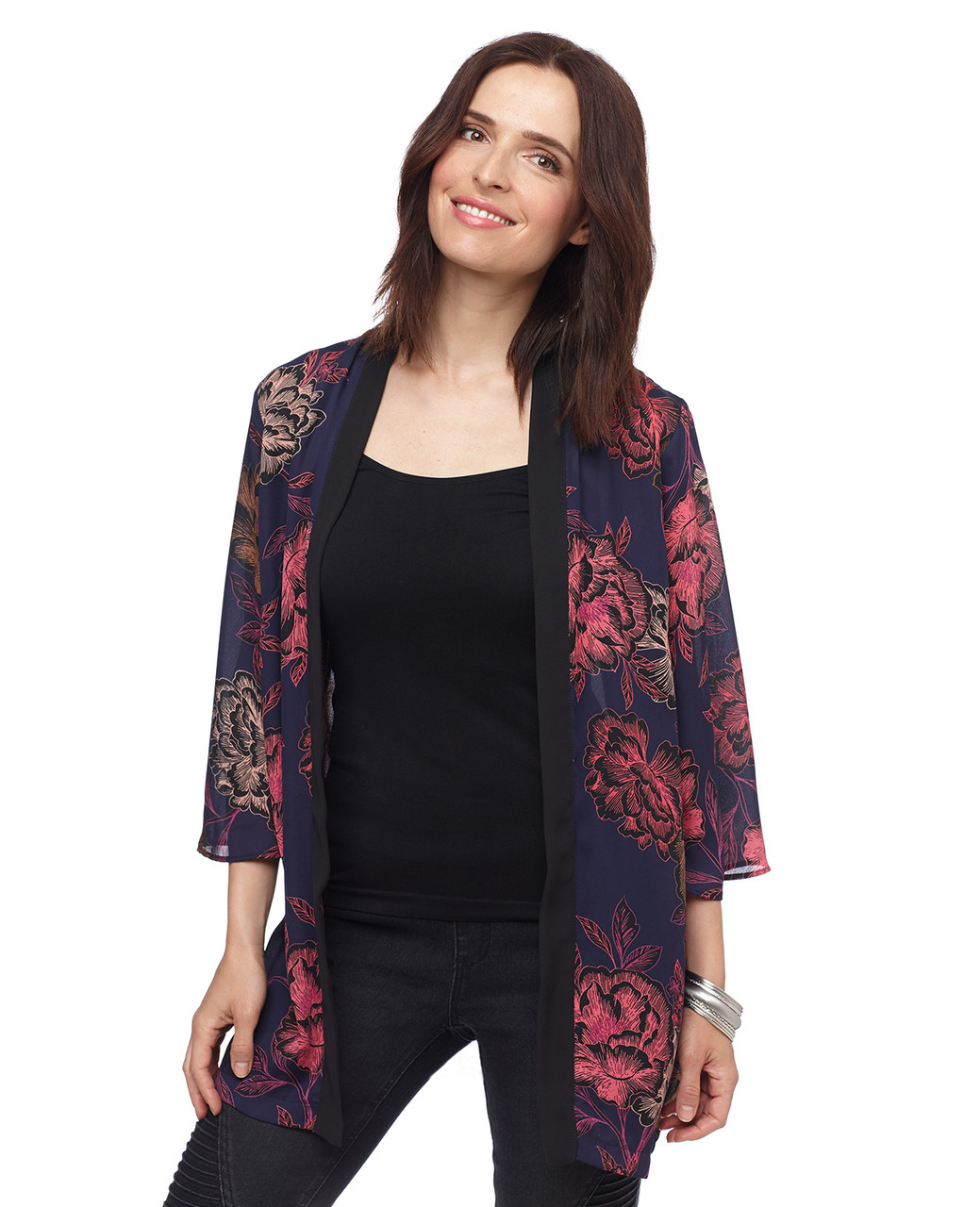 Woman in printed black woven open front top
