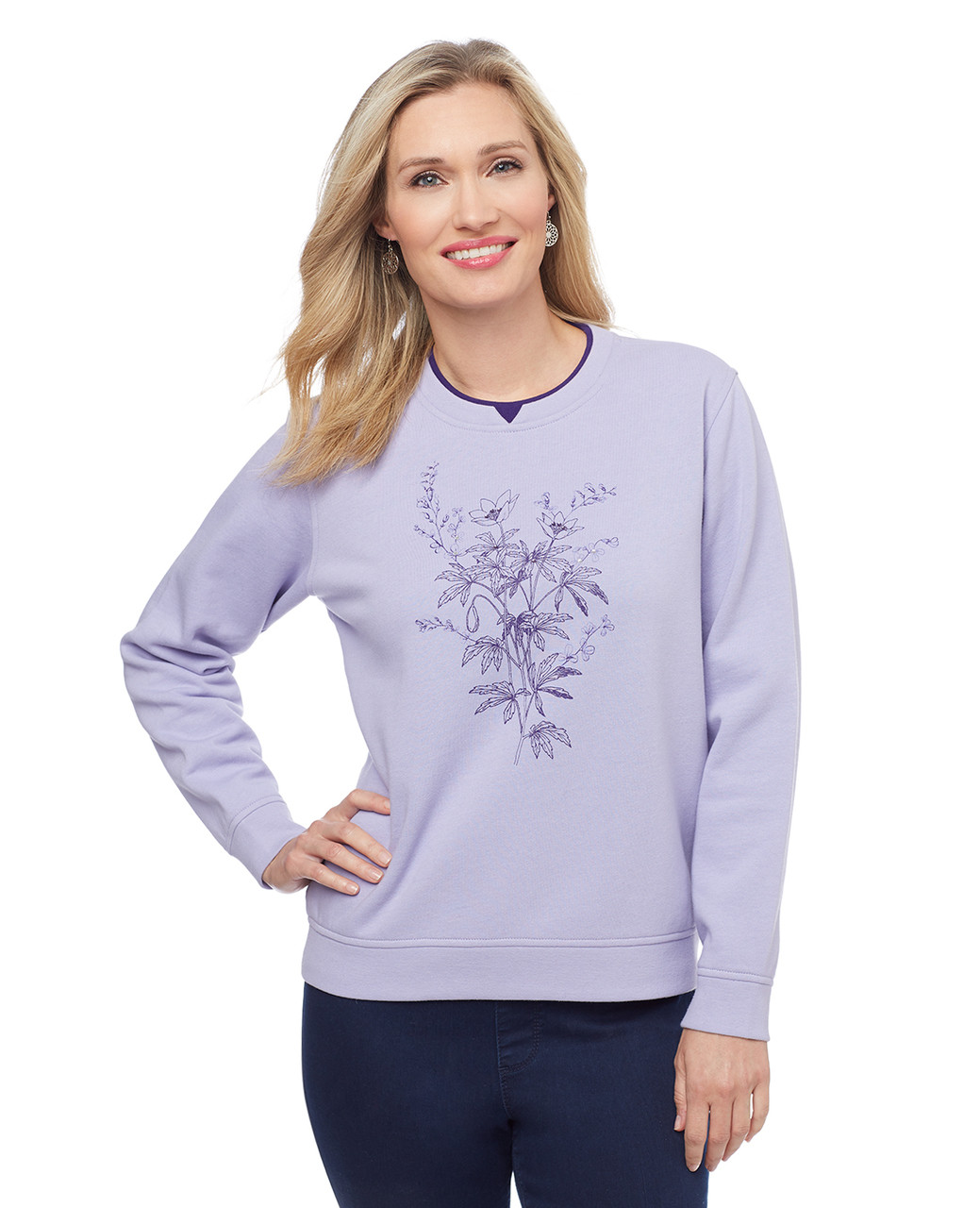 Woman in regal blue notch sweatshirt with floral screenprint