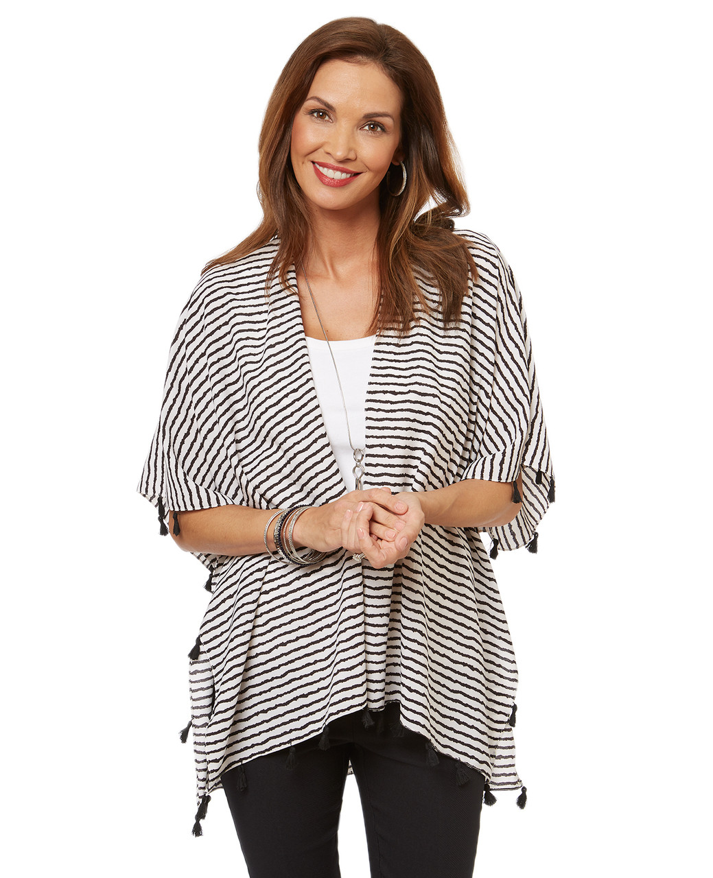 Women's striped cover up shawl with tassel edge.
