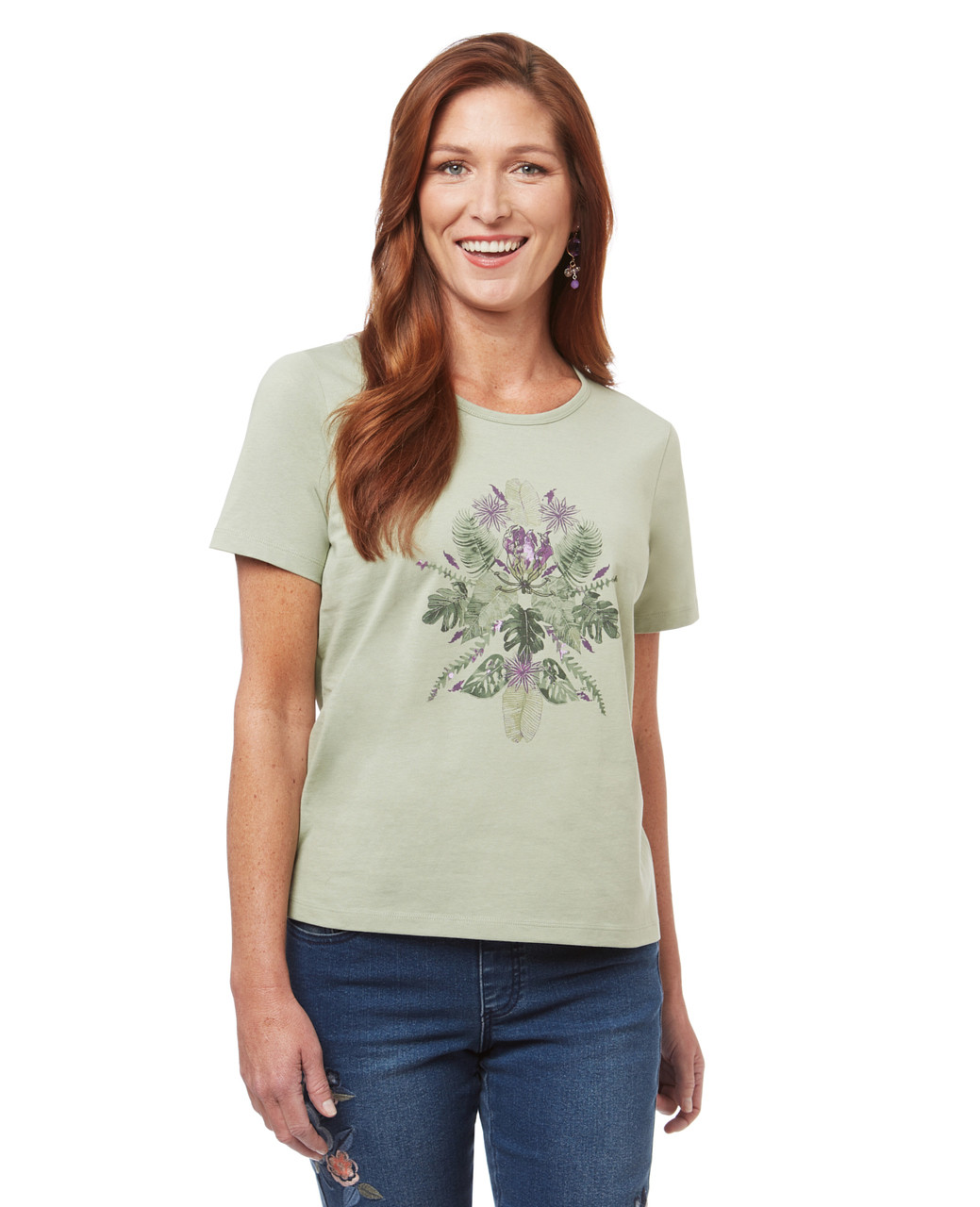 Women's graphic tee with tropical leaves.