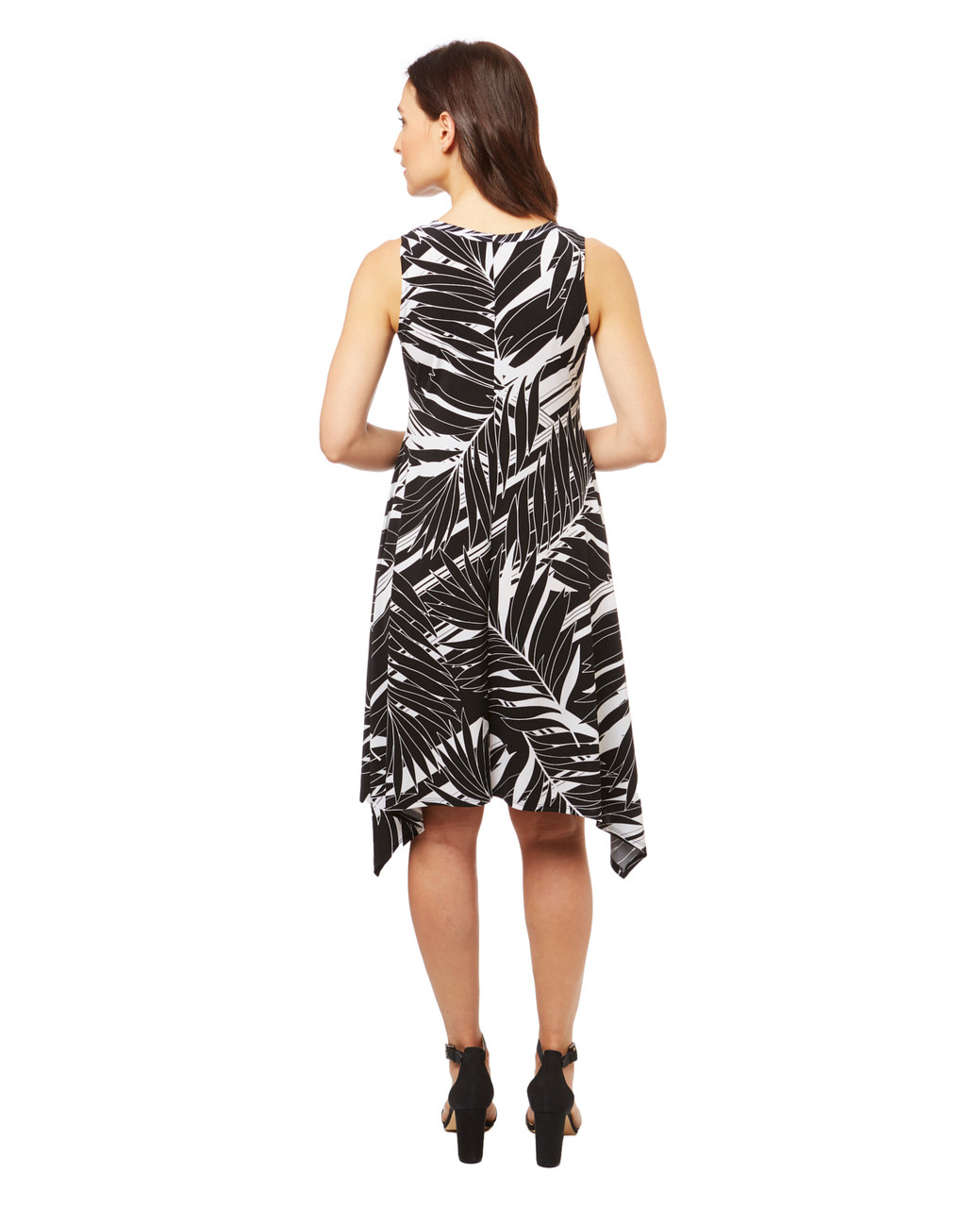 Women's handkerchief hem dress in a black and white floral print.