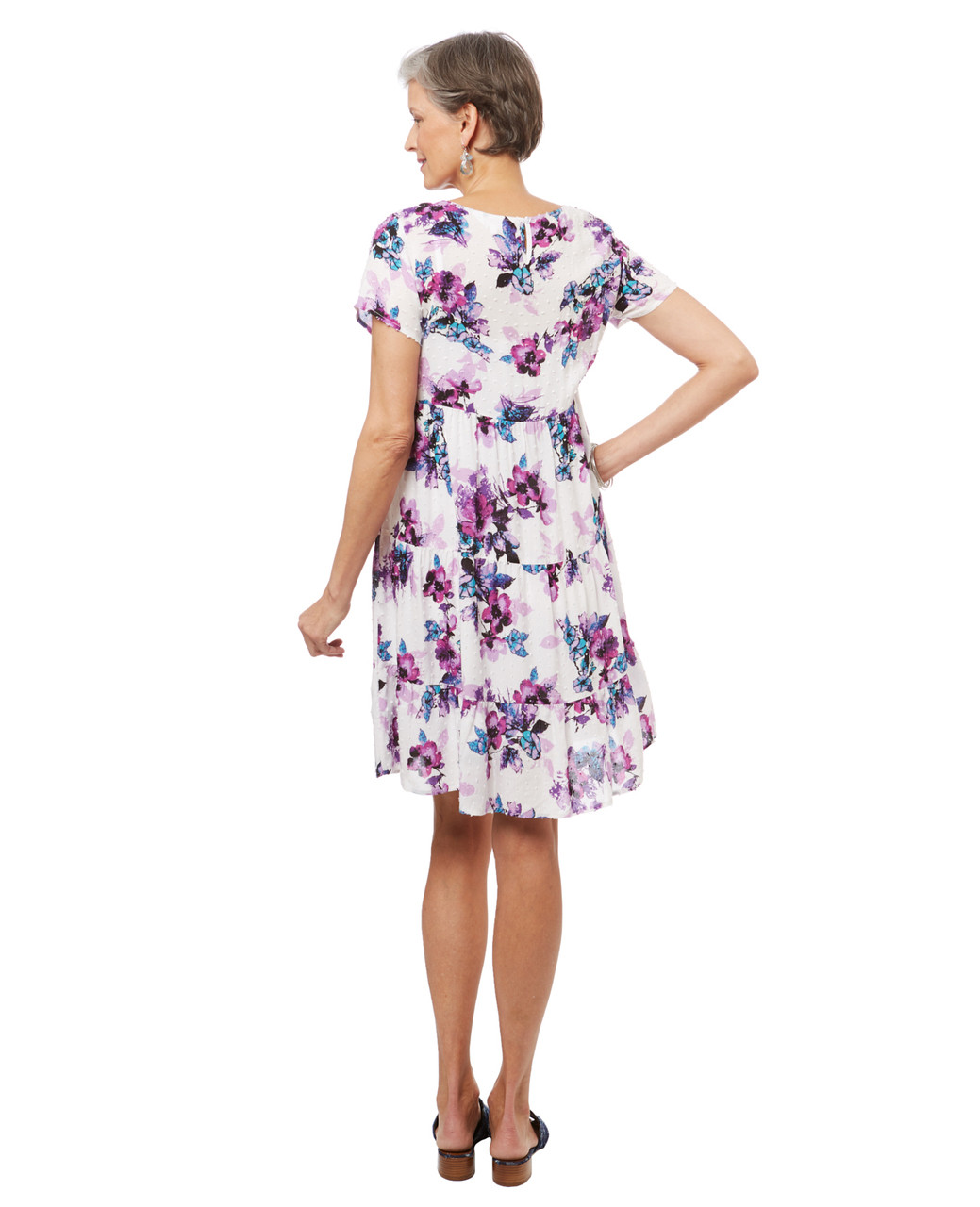 Women's tiered swiss dot babydoll dress in a lilac floral print.