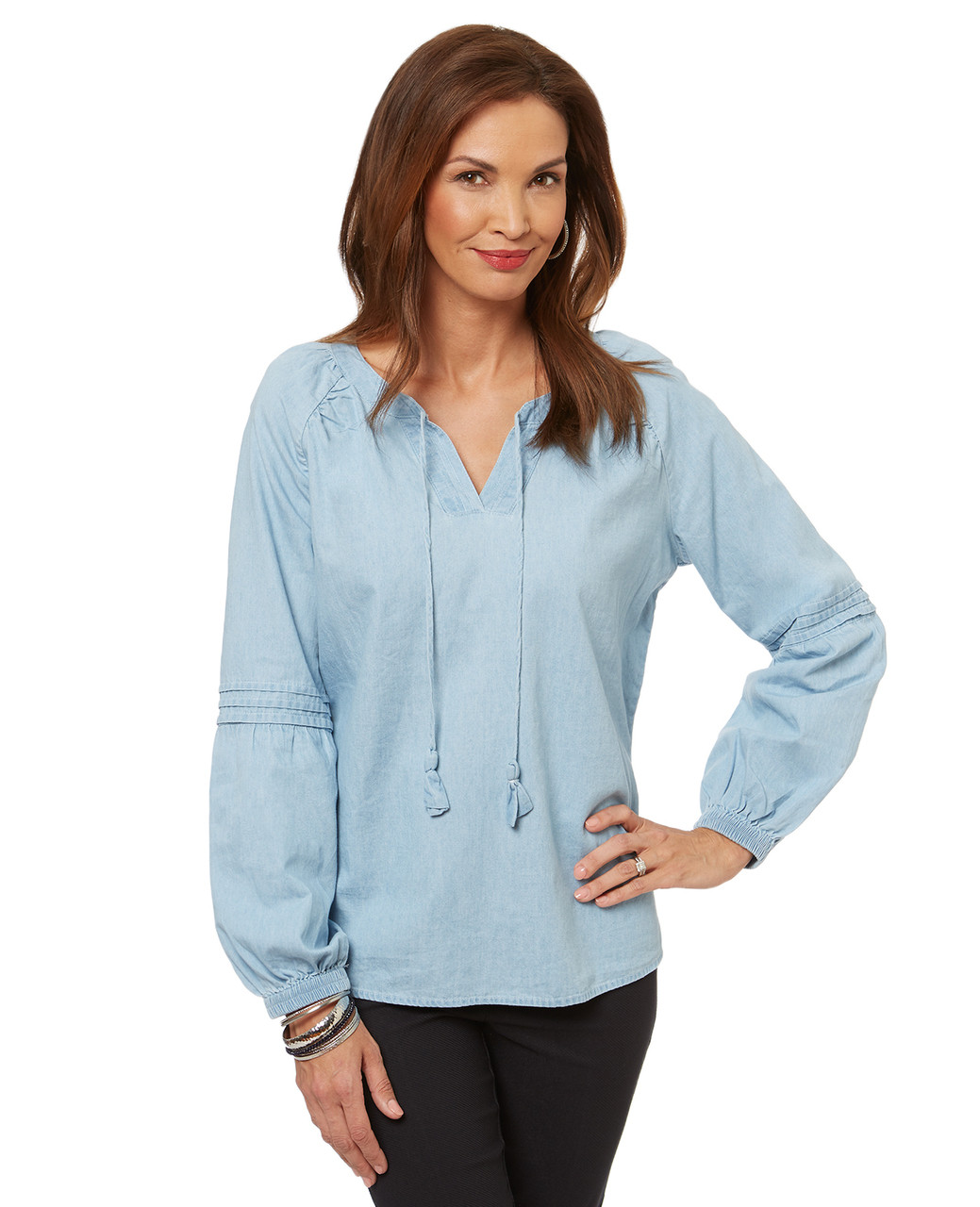 Women's peasant top blouse in a light denim-style fabric.