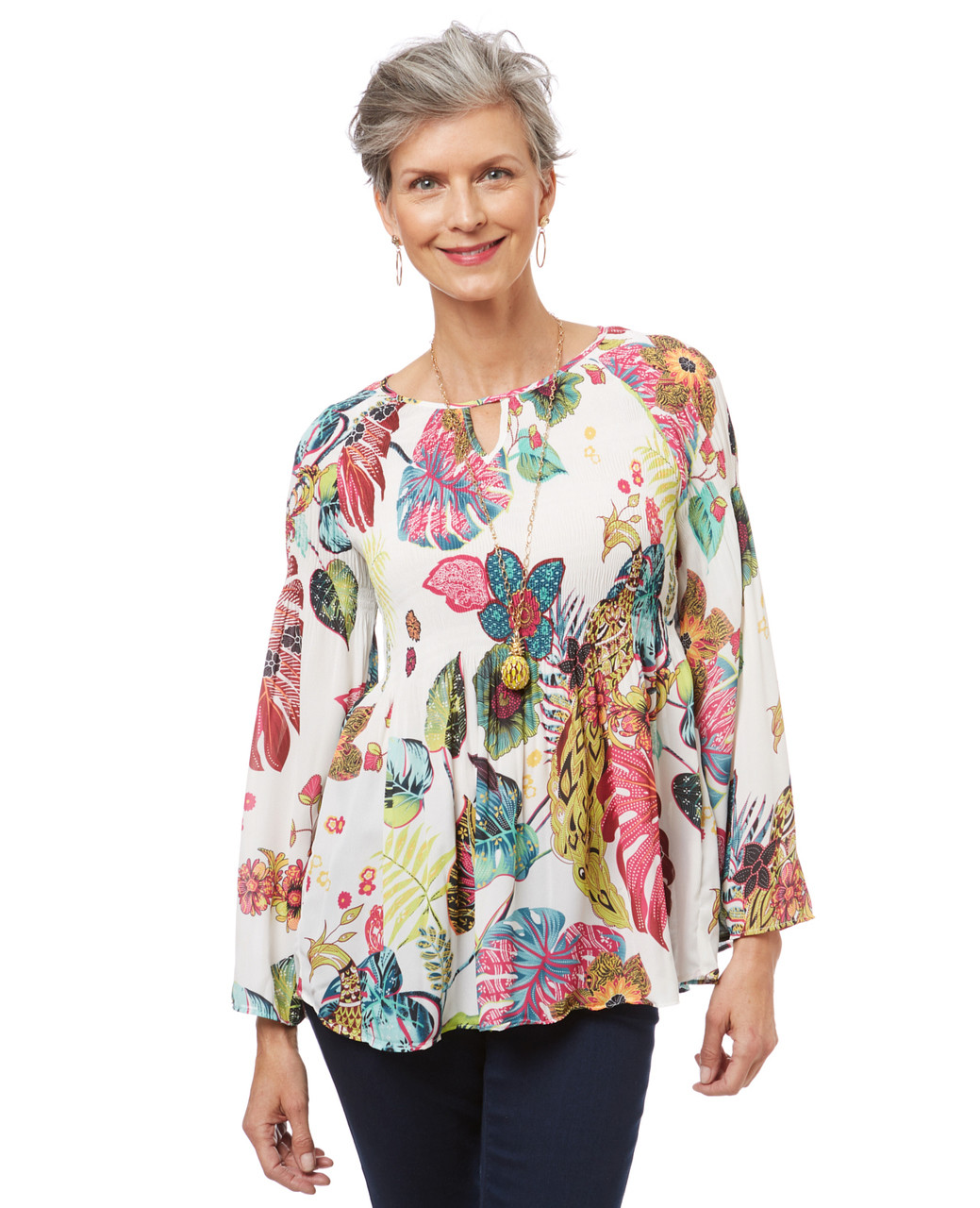 Women's white bell sleeve top in a tropical print with ruffled hem