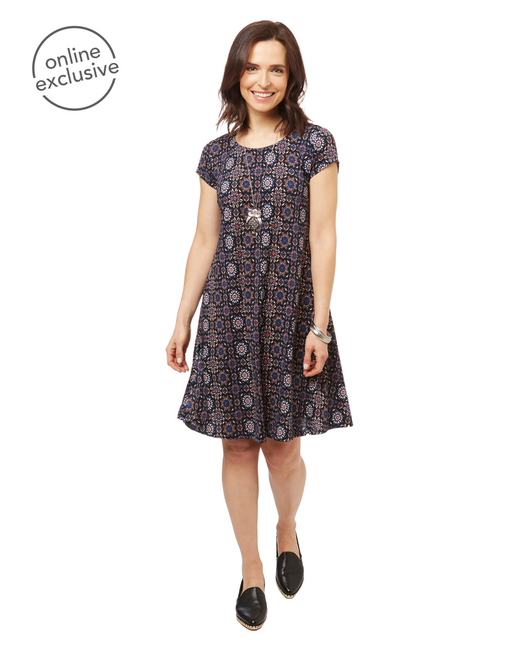 Women's short sleeve boho swing dress in a black geometric print.