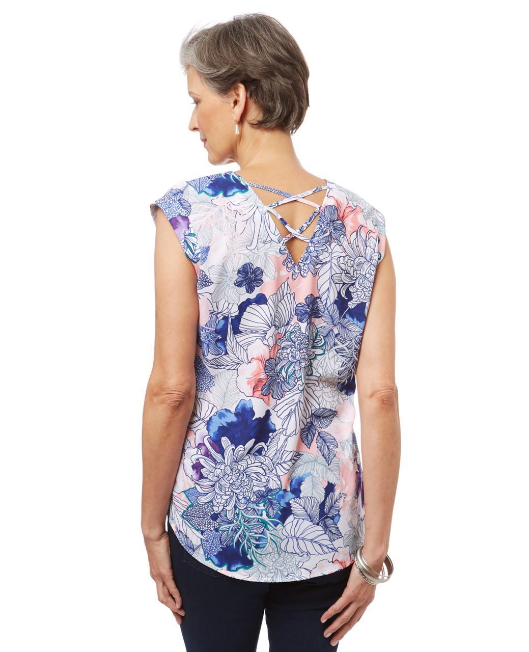 Women's short sleeve blouse in a floral print with criss cross detail in the back