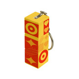 A custom square cube with keyrings, featuring vibrant yellow and red designs, and a keyring attached.