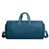 A teal convertible duffel bag with handles and a shoulder strap, featuring a zippered side pocket and branding.