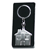 A silver keyring shaped like a house, presented in a black box. Features a simple design and a clasp attachment.