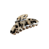 A hair clip in beige and black with a marbled pattern, featuring a large, curved design and multiple grip prongs.