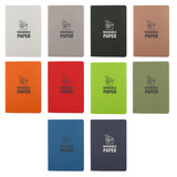 A collection of ten Washable Paper Notebooks in various colours including white, grey, orange, green, and blue, featuring logos.