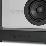 A speaker with a white front and dark grey base, featuring a circular speaker grille and control buttons.